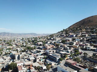 Aerial photo of a hill in Mexico from a drone. Bird's eye view of a town.