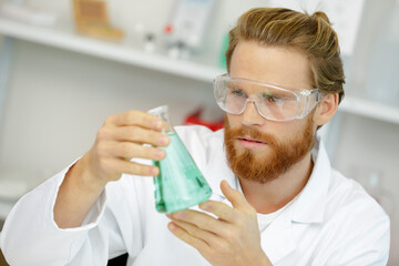 male researcher experimenting in the lab © auremar