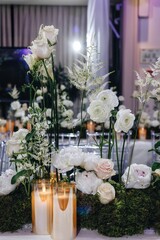 tableware Glasses, flower fork, knife served for dinner in restaurant with cozy interior