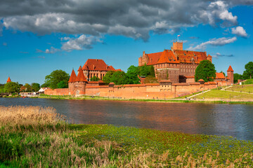 Naklejka na ściany i meble The Castle of the Teutonic Order in Malbork by the Nogat river.
