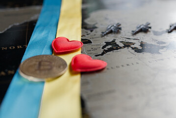 Machine guns on the background of a map of Europe and hearts with the Ukrainian ensign.