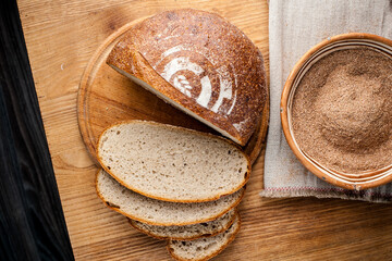 Bread. Baked bread. Craft bakery. Sliced bread on a wooden background. Food blog, food, pastries, flour, hot, fragrant, morning, fresh bread
