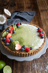 Matcha custard tart topped with fresh berries
