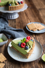 Matcha custard tart topped with fresh berries
