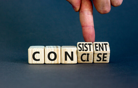 Concise or consistent symbol. Businessman turns wooden cubes and changes concept word Concise to Consistent. Beautiful grey table grey background. Business concise or consistent concept. Copy space.