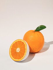 Fresh organic and white colored orange fruit on white background. Minimal food  concept.