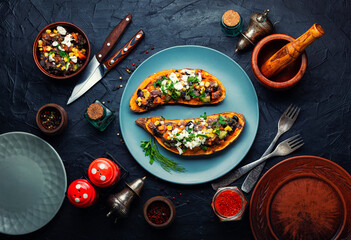 Sweet potato stuffed with vegetables and cottage cheese.