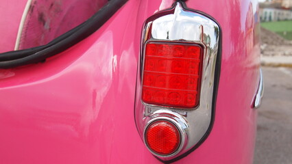 Tail light of a pink retro car close-up, Cuba, Havana