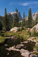 Obraz premium Rocky Mountain National Park with a trail that gives hikers a dramatic view of nature and high mountain peaks in Northern Colorado.