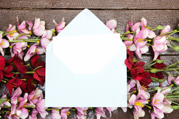 blank card mock-up, blank template above  flowers on wood table for mother's o women's day concept 