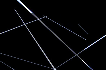 Abstract image made from photos of long LED lights, black background, nobody
