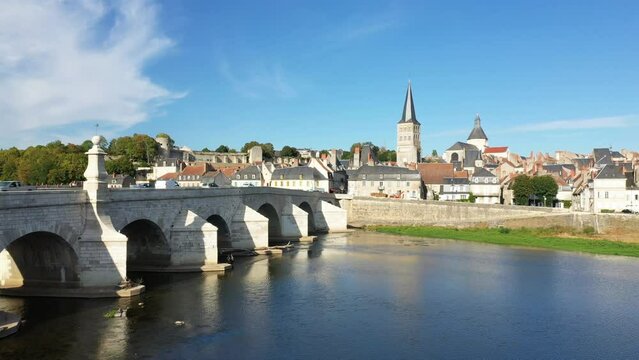 The Loire under the Charite sur Loire bridge in Europe, France, Burgundy, Nievre, in summer, on a sunny day.