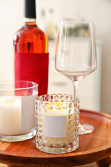 Holders with burning candles on table, closeup