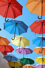 Colored umbrellas in the sky