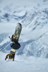 Snowboard high up in the snowy Alps