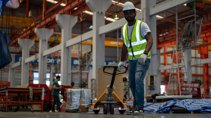 Fototapeta premium Diverse Team of Workers use Hand Pallet Truck Start Loading in Manufacturing Factory industry concept