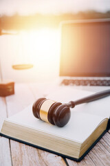 Obraz premium justice and law concept.Male judge in a courtroom on wooden table and Counselor or Male lawyer working in office. Legal law, advice and justice concept.
