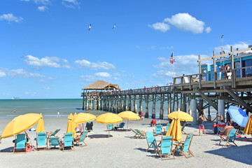 Umbrellas and chairs at Cocoa Beach pier near Cape Canaveral on Florida's Space Coast