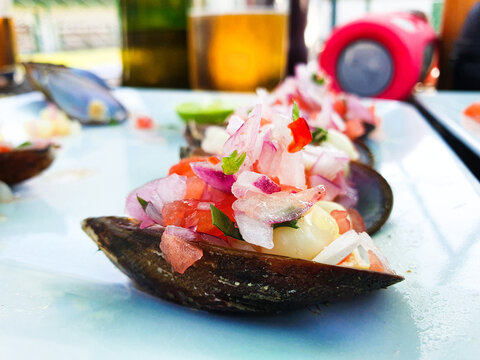 Choros a la chalaca . Traditional Peruvian food with mussels.