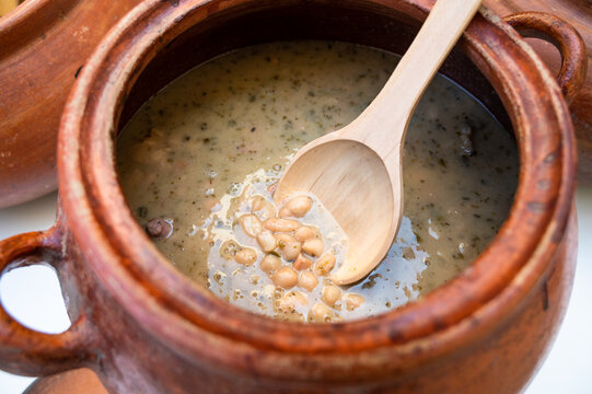 Clay pot with traditional Peruvian food called seco con frejoles.