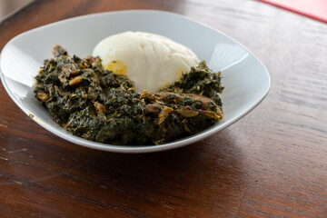 Pounded Yam served with spicy vegetable soup