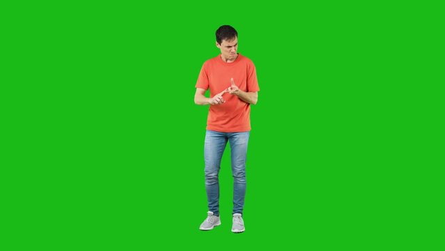 Thoughtful man counting on fingers in studio