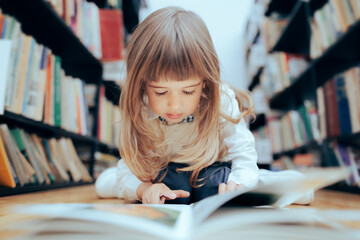 Smart Little Girl Checking a Book at the Library
