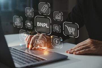 BNPL-Buy Now Pay Later shopping online icon concept, Young businessman using laptop with BNPL icon.