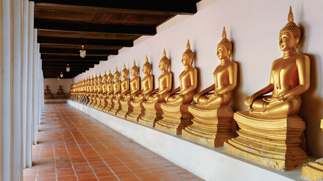 a row of Golden Buddha statue at Wat Phutthaisawan, Ayutthaya, Thailand,