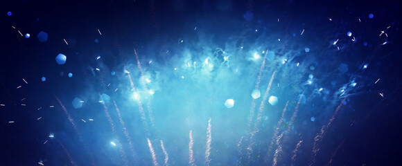 abstract black, blue and gold glitter background with fireworks