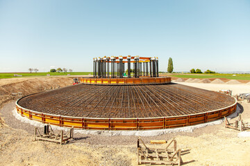 Construction site. concrete foundation of wind turbines with concrete and steel. building wind...