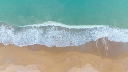 Fototapeta na wymiar Aerial view summer with seascape as beach waves from the Top view by drone. Travel concept