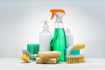 Eco brushes, sponges and eco spray bottle for safety cleaning, on light grey background.  cleaning products. Cleaner concept