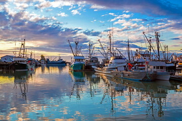  
Fishing Boats in Marina and a cloudy sky. This marina is located in the Steveston area of...