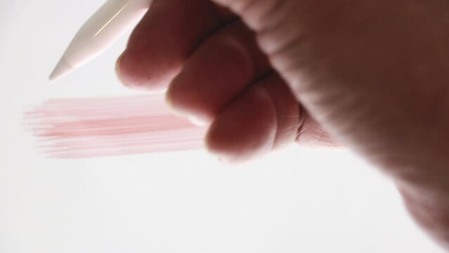 closeup hand write pencil on tablet with brush hair