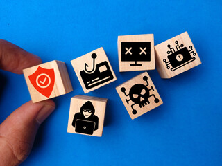 Wooden cubes with cyber icons with the concept of network security vulnerabilities