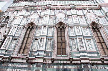 Fototapeta premium Architectural detail of polychrome marble facade exterior of Florence Cathedral Duomo architecture