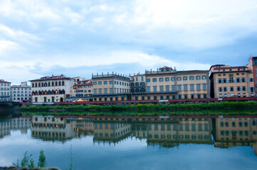 Fototapeta na wymiar Florence waterfront with Ponte alla Carraia bridge over Arno river in Italy