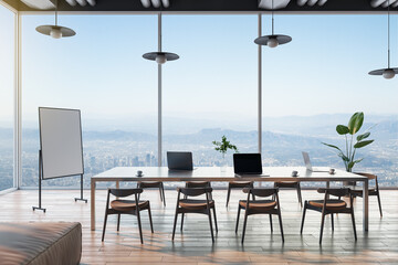 Modern loft office interior with empty white mock up stand, panoramic city view, daylight, furniture and equipment. Design and workplace concept. 3D Rendering.