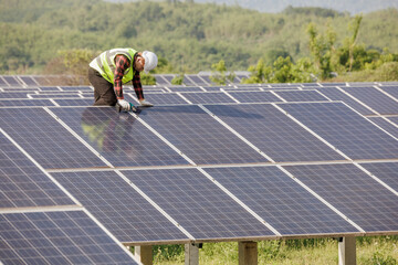 worker installing the solar panels.Solar power energy. renewable energy, Solar power plant. worker...