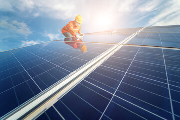 Man is working on cleaning solar panels. repair, maintenance, reuse, and periodical maintenance of...