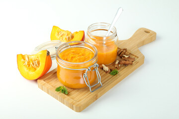Concept of tasty food, pumpkin jam on white background