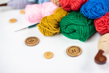 Fototapeta na wymiar knitting hobbies of yarn ball for background. colorful wool balls of knitted yarn. The concept of handmade work, needlework and the sale of thread. Top view.Flatlаy.Rainbow layout. Copy space.