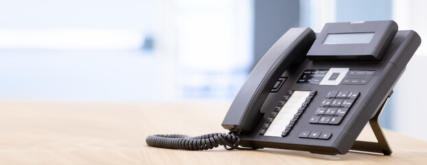Close up telephone landline at office concept Communication support, call center and customer...