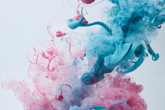 Pink and blue paint in water over gray background