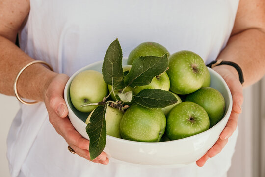 Bowl of fresh picked green apples.