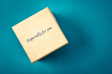 Top view of a present box package isolated on blue.