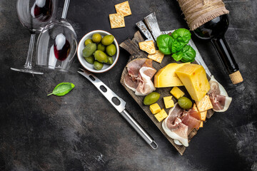 Antipasto board Platter with Spanish ham jamon serrano or Italian prosciutto crudo, Italian hard...