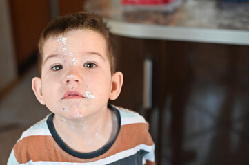 Little boy with an allergic rash on his face. Kid boy with chicken pox. Mosquito bites, roseola,...