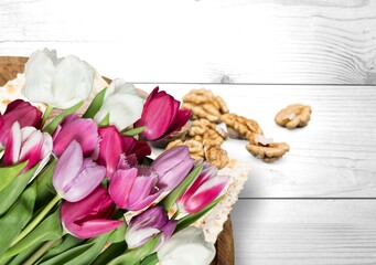 Jewish holiday. Matzah with tulip flowers on blue table.background, top view, copy space.